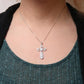 A radiant blend of elegance and faith in sterling silver and diamonds. - Glide Goods LLC